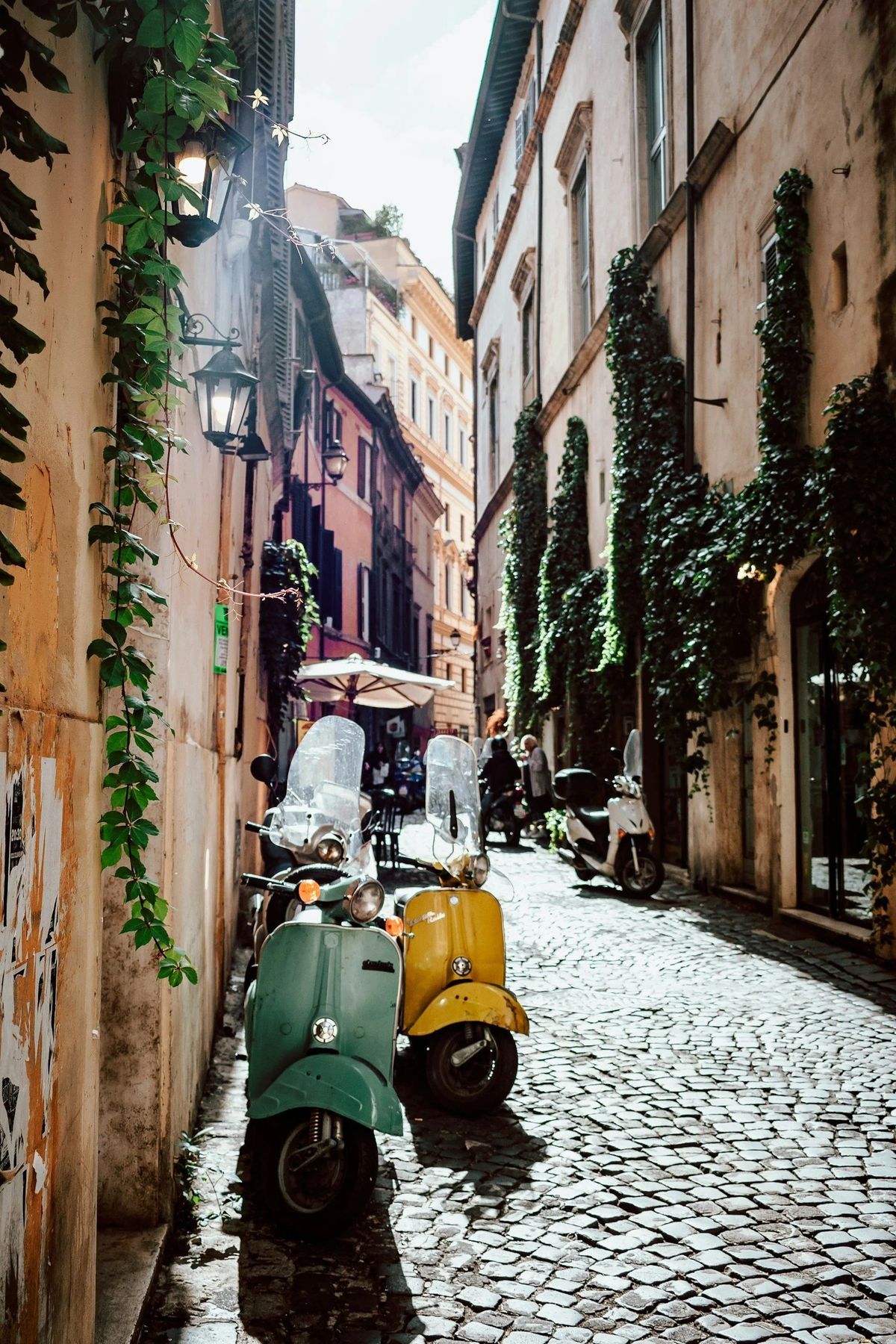 Vintage scooters on a cobbled street in Rome