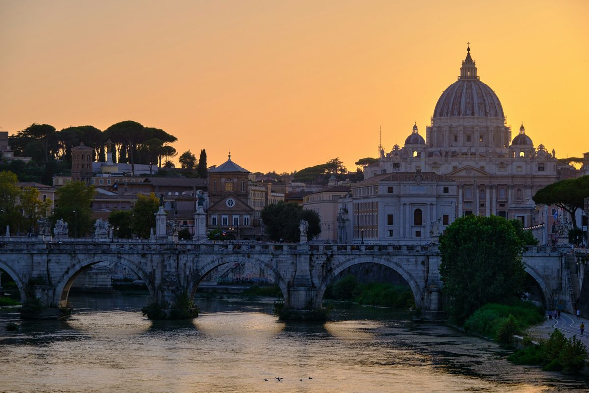 The dome of St Peter’s at sunset over the Tiber