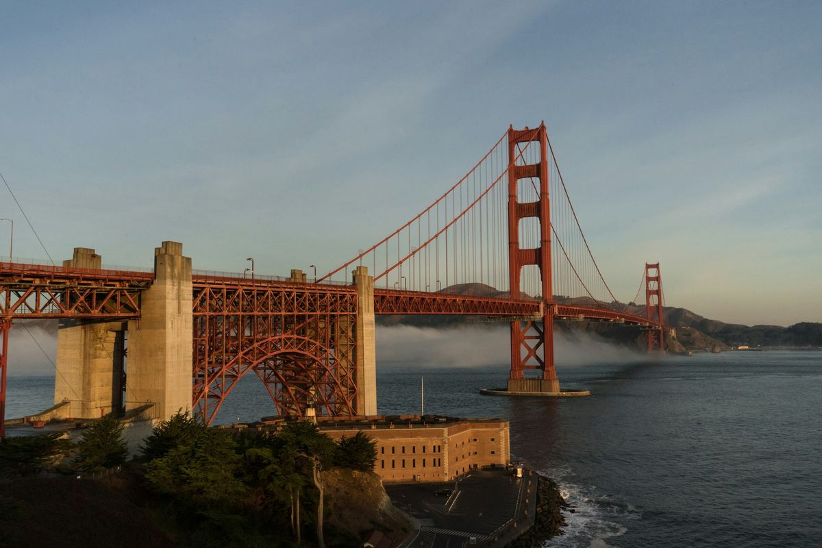 The Golden Gate Bridge and Fort Point with fog rolling in